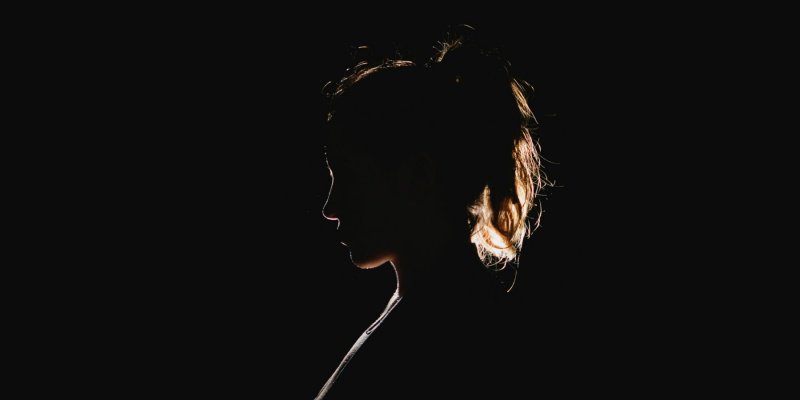 woman in dark light